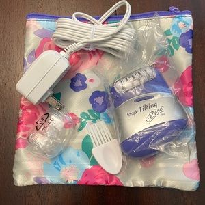 Never used. Emjoi Tilting eRase 60 Epilator